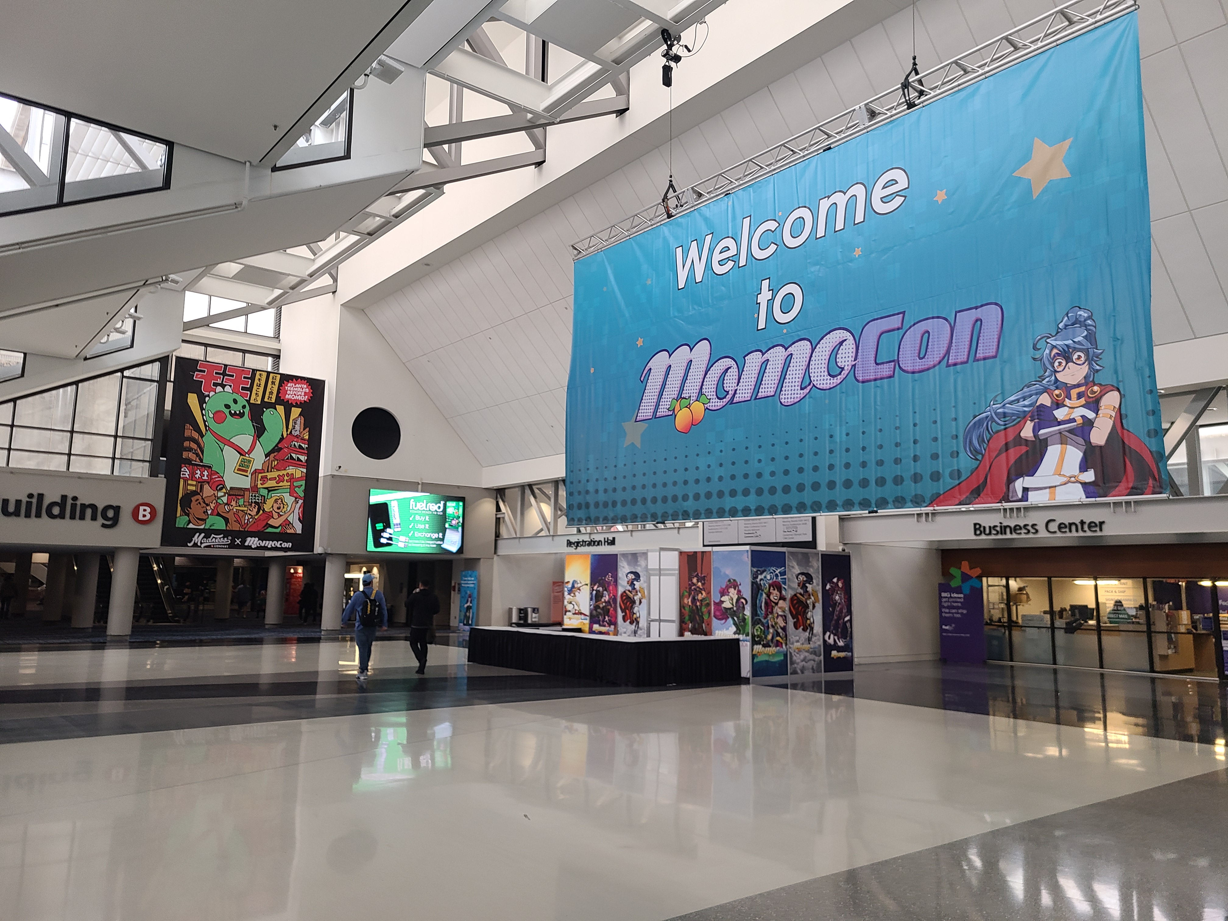 lobby of the convention center with large welcome to momocon2022 banner