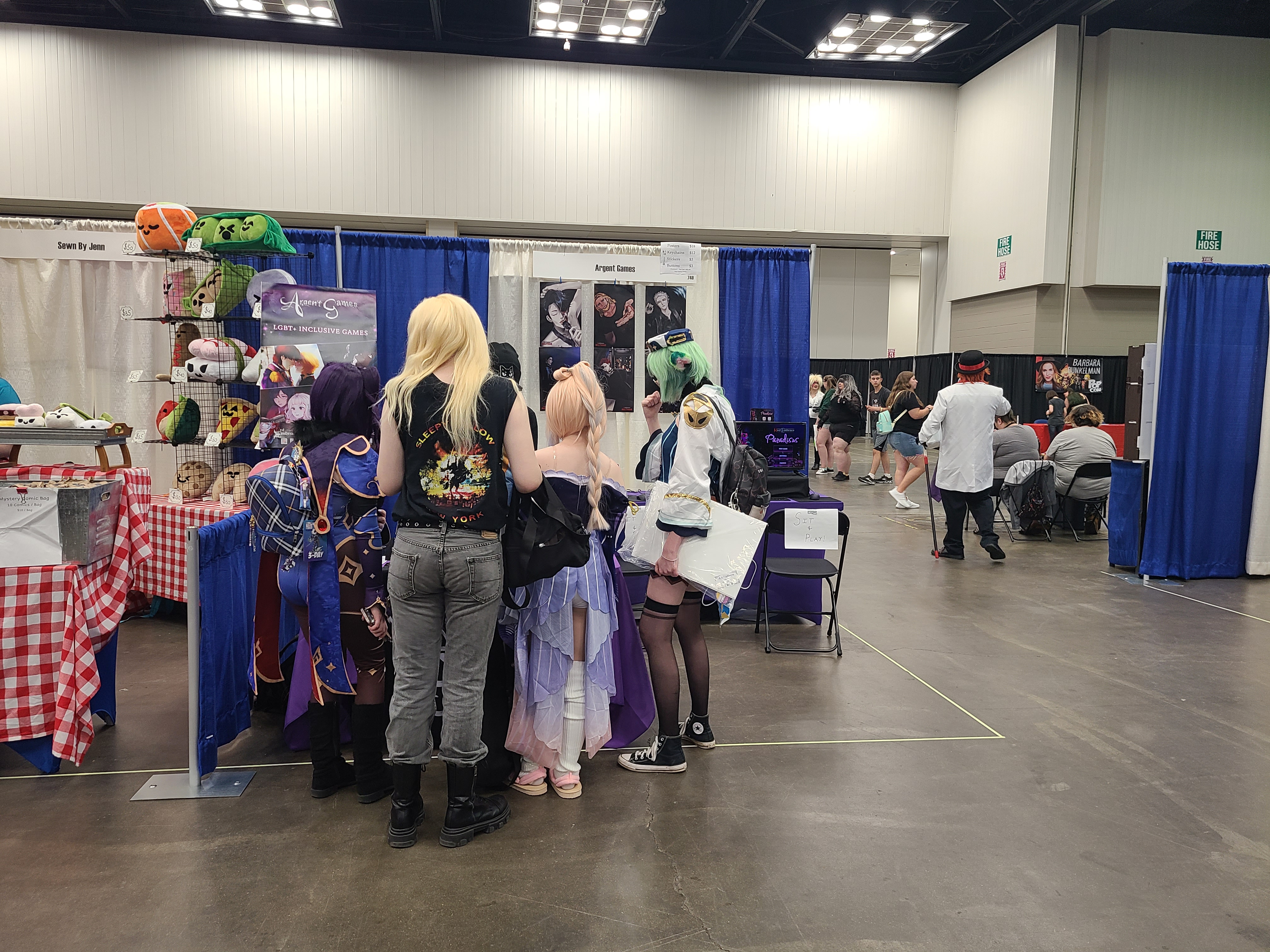 3 people crowding around the information table